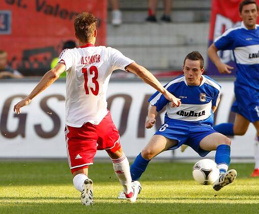 FUSSBALL - CL Quali, RBS vs Dudelange SALZBURG,AUSTRIA,24.JUL.12 - FUSSBALL - UEFA Champions League, Qualifikation, Red Bull Salzburg vs F91 Düdelingen. Bild zeigt Stefan Ilsanker (RBS) und Ben Payal (Dudelange). 