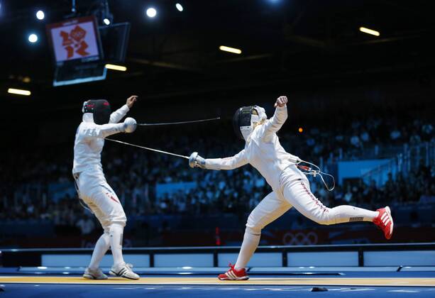 July 30, 2012 - London, England, United Kingdom - Great Britain s Corinna Lawrence (right) set up a last-32 contest with European champion Simona Gherman in the women s Epee with a win over Caterin Bravo Aranguiz. (left) .BRIAN PETERSON¢, England - 07 29 2012 Olympics 2012 - London - July 30, 2012 - ZUMAm42