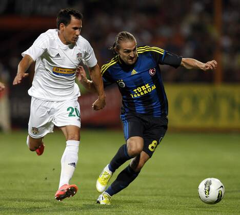 Champions League 3rd qualifying match between SC Vaslui and Fenerbahce Istanbul at the Municipal Ceahlaul Stadium in Piatra Neamt, Romania on 2012 08 08 Pictured: Zhivko Milanov (L) of SC Vaslui and Caner Erkin (R) of Fenerbahce. 