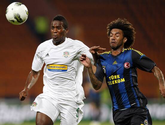 Champions League 3rd qualifying match between SC Vaslui and Fenerbahce Istanbul at the Municipal Ceahlaul Stadium in Piatra Neamt, Romania on 2012 08 08 Pictured: Christian Baroni (R) of Fenerbahce and Fernando Lopes dos Santos Varela (L) of SC Vaslui. 