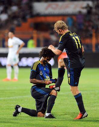 Champions League 3rd qualifying match between SC Vaslui and Fenerbahce Istanbul at the Municipal Ceahlaul Stadium in Piatra Neamt, Romania on 2012 08 08 Pictured: Christian Baroni and Dirk Kuyt (R) of Fenerbahce. 