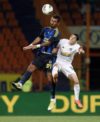 Champions League 3rd qualifying match between SC Vaslui and Fenerbahce Istanbul at the Municipal Ceahlaul Stadium in Piatra Neamt, Romania on 2012 08 08 Pictured: Selcuk Sahin (L) of Fenerbahce and Nicolae Stanciu (R) of SC Vaslui. 