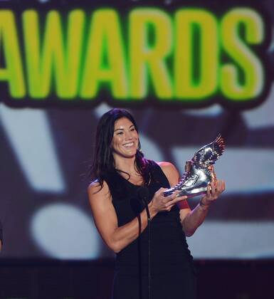 The U.S. women s soccer team goalie Hope Solo accepts her trophy after being selected the Athlete winner, beating out Cristiano Ronaldo, LeBron James, Tim Tebow and Serena Williams, during the Do Something Awards at Barker Hangar in Santa Monica, California on August 19, 2012.  LAP2012081926
