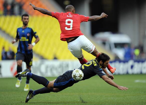 MOSCOW, RUSSIA. AUGUST 20, 2012. Spartak s Ari (top) and Egemen Korkmaz of Fenerbahce in action during a UEFA Champions League group stage match.  premiumd RE1065B5