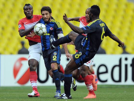 MOSCOW, RUSSIA. AUGUST 20, 2012. Spartak s Emmanuel Emenike, Egemen Korkmaz of Fenerbahce, Spartak s Ari and Joseph Yobo of Fenerbahce (L-R) in action during a UEFA Champions League group stage match Spartak (Moscow) vs. Fenerbahce S.K.  premiumd RE1065B8