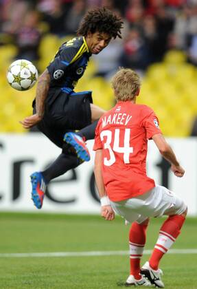 MOSCOW, RUSSIA. AUGUST 21, 2012. Cristian of Fenerbahce and Spartak s Evgeni Makeev (red) in action during a UEFA Champions League group stage match Spartak (Moscow) vs. Fenerbahce S.K.  premiumd RE1065BF