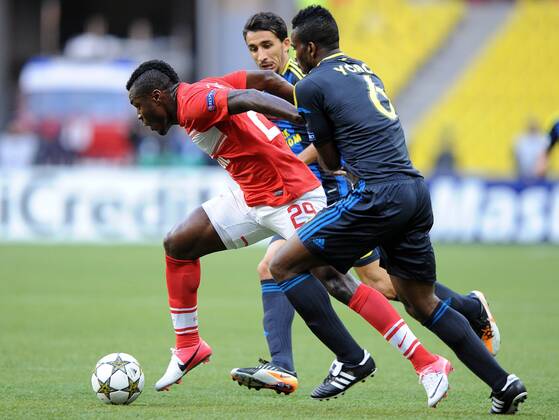 UEFA Champions League: Spartak (Russia) 2 - 1 Fenerbahce Turkey MOSCOW, RUSSIA. AUGUST 21, 2012. Emmanuel Emenike of Spartak, Mehmet Topal and Joseph Yobo of Fenerbahce (L-R) in action during a UEFA Champions League group stage match Spartak (Moscow) vs. Fenerbahce S.K.  premiumd RE1065C2