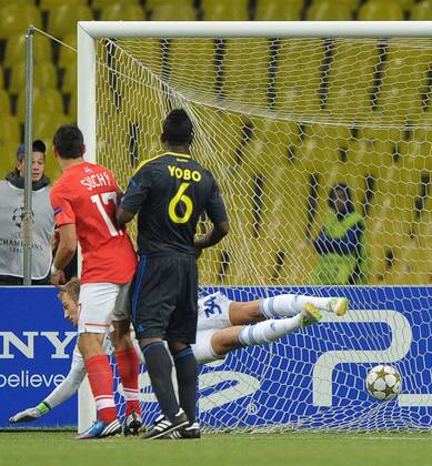 MOSCOW, RUSSIA. AUGUST 21, 2012. Marek Suchy of Spartak (L) and Joseph Yobo of Fenerbahce look on as goalie Mert Gunok of Fenerbahce allows a goal during a UEFA Champions League group stage match Spartak (Moscow) vs. Fenerbahce S.K.  premiumd RE1065C8