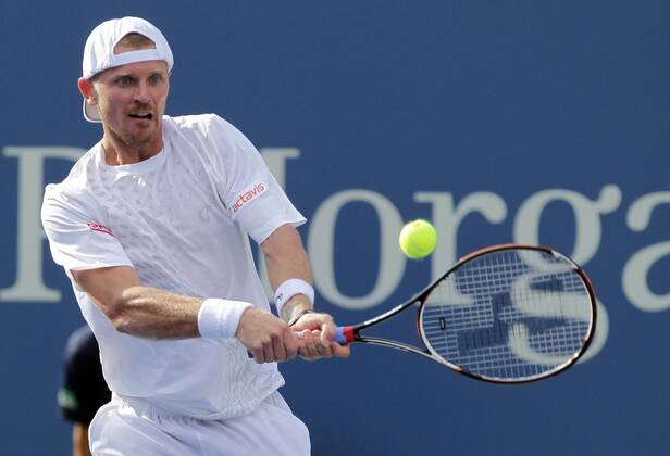Alex Bogolomov (RUS) hits a backhand in first round match at the 2012 U.S. Open Tennis Championships in Arthur Ashe Stadium at the Billie Jean King National Tennis Center in New York City on August 27, 2012.  NYP20120827101