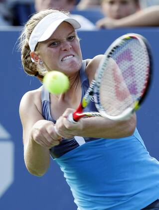 Melanie Oudin hits a backhand in first round match at the 2012 U.S. Open Tennis Championships in Arthur Ashe Stadium at the Billie Jean King National Tennis Center in New York City on August 27, 2012.  NYP20120827104
