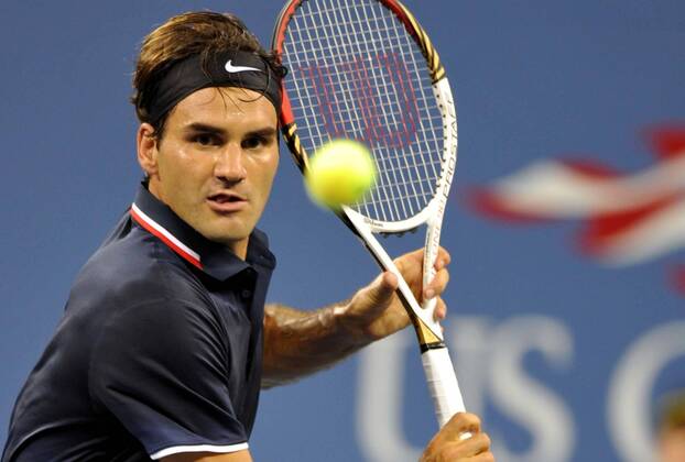 NEW YORK, Aug. 28, 2012 -- Roger Federer of Switzerland returns the ball during the men s singles 1st round match of the United States at the 2012 U.S. Open tournament in New York, the United States, Aug. 27, 2012. 