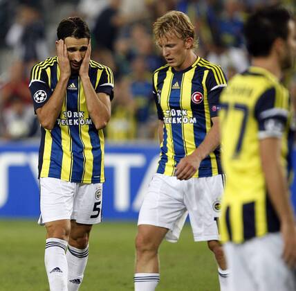 Champions League play off match between Fenerbahce and Spartak Moscow at Sukru Saracoglu Stadium in Istanbul, Turkey on 2012 08 29 Match Scored: Fenerbahce 1 - Spartak Moscow 1 Pictured: Dirk Kuyt and Mehmet Topal of Fenerbahce. 