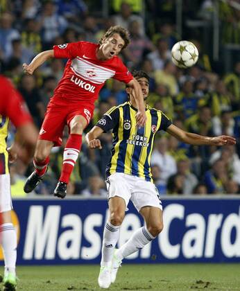 Champions League play off match between Fenerbahce and Spartak Moscow at Sukru Saracoglu Stadium in Istanbul, Turkey on 2012 08 29 Match Scored: Fenerbahce 1 - Spartak Moscow 1 Pictured: Dmitri Kombarov of Spartak Moscow and Mehmet Topal of Fenerbahce. 