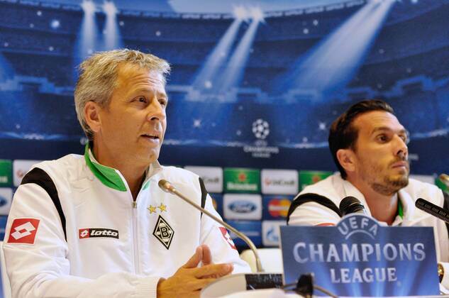 Coach Lucien Favre and Defender of VfL Borussia Mönchengladbach Martin Stranzl speaks during a press conference before the UEFA Champions League play-off round second-leg match against FC Dynamo Kyiv at the conference hall of the National Complex Olimpiyskiy, Kyiv, capital of Ukraine, August 28, 2012. UKRINFORM. 
