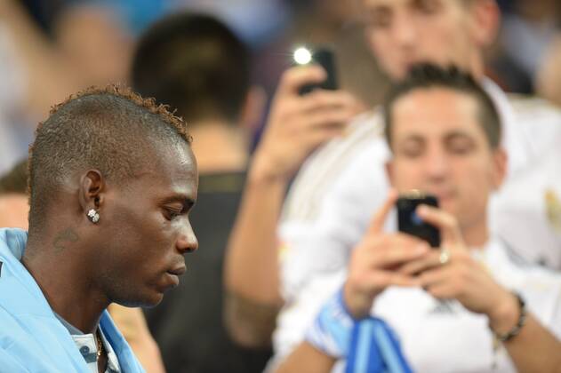 Football - Champions League - Real Madrid v Manchester City Manchester City striker Mario Balotelli in the stands before the match at Estadio Santiago Bernaeu in Madrid 