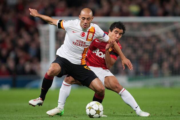 Football - Champions League - Manchester United vs. Galatasaray AS Nordin Amrabat of Galatasaray and Rafael of Manchester United at Old Trafford 