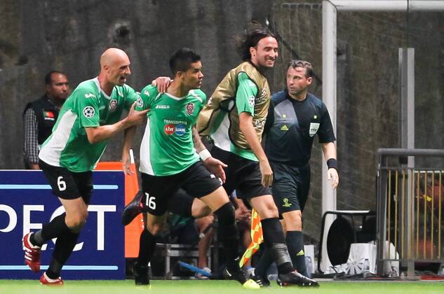 players of CFR Cluj celebrate the 2-0 goal scored by the Brazilian Rafael Bastos during the UEFA Champions League, Group H, match against CFR Cluj at AXa Stadium in Braga. 