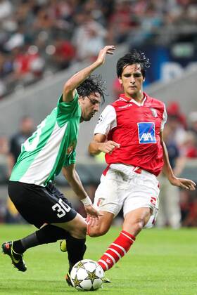 Rui Pedro (L) of CFR Cluj challenges Custodio (R) of SC Braga during the UEFA Champions League, Group H, match against SC Braga at AXa Stadium in Braga. 
