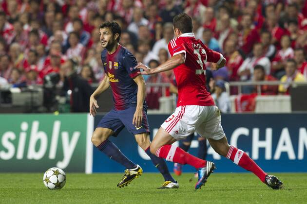2 October 2012 - Lisbon, Portugal - Cesc Fabregas FC Barcelona midfielder (L) and Jardel SL Benfica defender (R) during the UEFA Champions League soccer match between SL Benfica and FC Barcelona for group stage - group D, at SL Benfica, Luz stadium in Lisbon. 