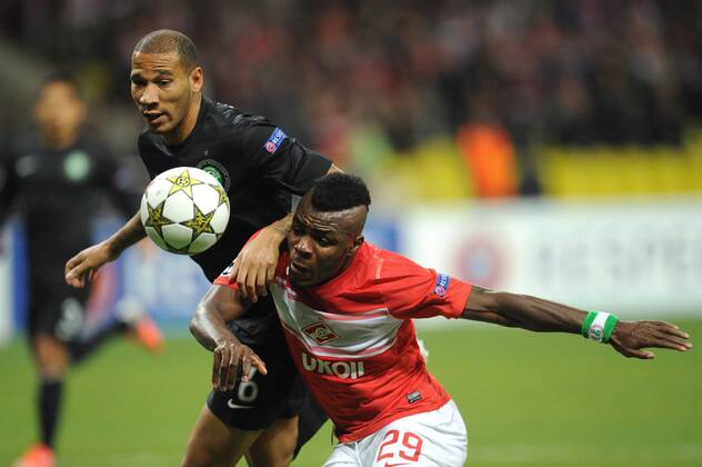 ITAR-TASS: MOSCOW, RUSSIA. OCTOBER 2, 2012. Spartak Moscow s Emmanuel Emenike (in red) and Celtic s Kelvin Wilson in action in their UEFA Champions League Group G football match at Luzhniki Stadium.  premiumd RE109CD7