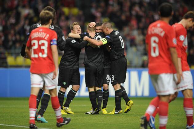 ITAR-TASS: MOSCOW, RUSSIA. OCTOBER 2, 2012. Spartak Moscow players (in red) look dejected as the Celtic team celebrate a goal in their UEFA Champions League Group G football match at Luzhniki Stadium.  premiumd RE109CDF