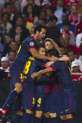2 October 2012 - Lisbon, Portugal - Barcelona team celebrating their second goal during the UEFA Champions League soccer match between SL Benfica and FC Barcelona for group stage - group D, at SL Benfica, Luz stadium in Lisbon. 