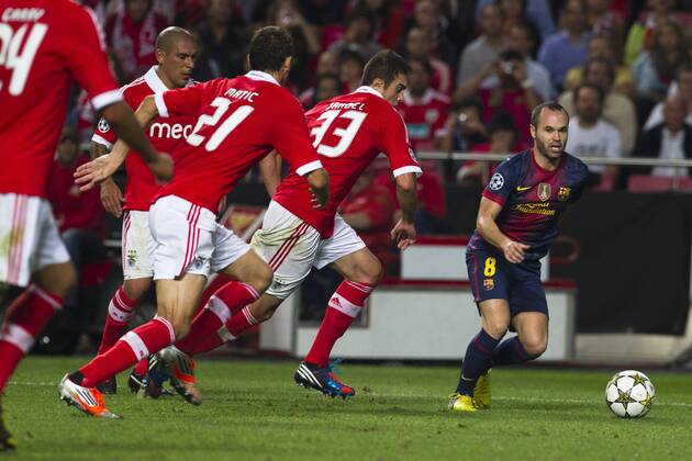 2 October 2012 - Lisbon, Portugal - Andres Iniesta FC Barcelona midfielder (R) passing by SL Benfica players during the UEFA Champions League soccer match between SL Benfica and FC Barcelona for group stage - group D, at SL Benfica, Luz stadium in Lisbon. 