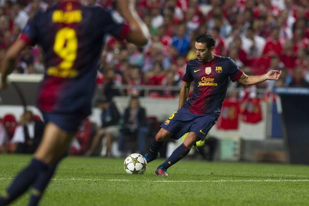 2 October 2012 - Lisbon, Portugal - Xavi Hernandez FC Barcelona midfielder shooting the ball during the UEFA Champions League soccer match between SL Benfica and FC Barcelona for group stage - group D, at SL Benfica, Luz stadium in Lisbon. 