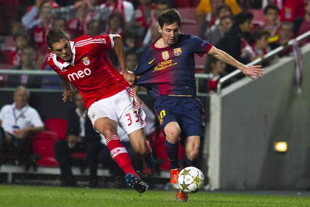 2 October 2012 - Lisbon, Portugal - Jardel SL Benfica defender (L) and Lionel Messi FC Barcelona forward (R) during the UEFA Champions League soccer match between SL Benfica and FC Barcelona for group stage - group D, at SL Benfica, Luz stadium in Lisbon. 