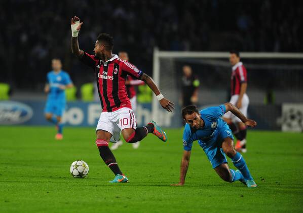ITAR-TASS: ST PETERSBURG, RUSSIA. OCTOBER 3, 2012. Milan s Kevin-Prince Boateng (L) and Zenit s Roman Shirokov in action in their UEFA Champions League Group C football match at Petrovsky Stadium. A.C. Milan won the game 2-3.  RE109E36