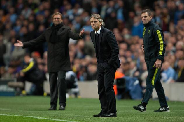 Football - Champions League - Manchester City vs. Borussia Dortmund Jurgen Klopp, manager of Dortmund and Roberto Mancini, manager of Manchester City at the Etihad Stadium 
