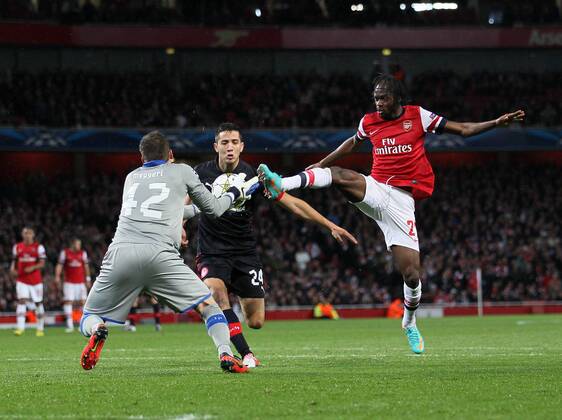 Arsenal s Gervinho tussles with Olympiacos Balazs Megyeri..Football - Champions League Matchday 2 - Emirates Stadium, London - 3 10 12EDITORIAL USE ONLY.... EDITORIAL USE ONLY. No use with unauthorised audio, video, data, fixture lists, club league logos or live services. Online in-match use limited to 120 images, no video emulation. No use in betting, games or single club league player publications.