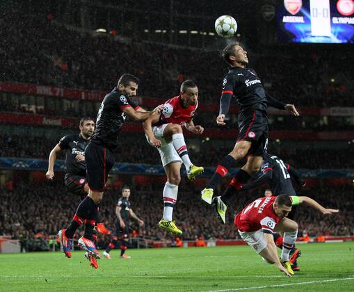 Arsenal s Francis Coqeulin and Thomas Vermaelen attack the ball..Football - Champions League Matchday 2 - Emirates Stadium, London - 3 10 12EDITORIAL USE ONLY.... EDITORIAL USE ONLY. No use with unauthorised audio, video, data, fixture lists, club league logos or live services. Online in-match use limited to 120 images, no video emulation. No use in betting, games or single club league player publications.