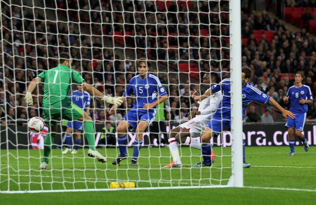 England s Danny Welbeck scoring his sides fourth goal..England v San Marino - FIFA World Cup Qualifier - Wembley Stadium- 12 10 12 - Picture David Klein Sportimage EDITORIAL USE ONLY. No use with unauthorised audio, video, data, fixture lists, club league logos or live services. Online in-match use limited to 120 images, no video emulation. No use in betting, games or single club league player publications.