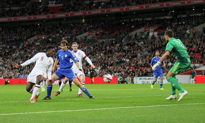 England s Danny Welbeck scoring his sides second goal..England v San Marino - FIFA World Cup Qualifier - Wembley Stadium- 12 10 12 - Picture David Klein Sportimage EDITORIAL USE ONLY. No use with unauthorised audio, video, data, fixture lists, club league logos or live services. Online in-match use limited to 120 images, no video emulation. No use in betting, games or single club league player publications.