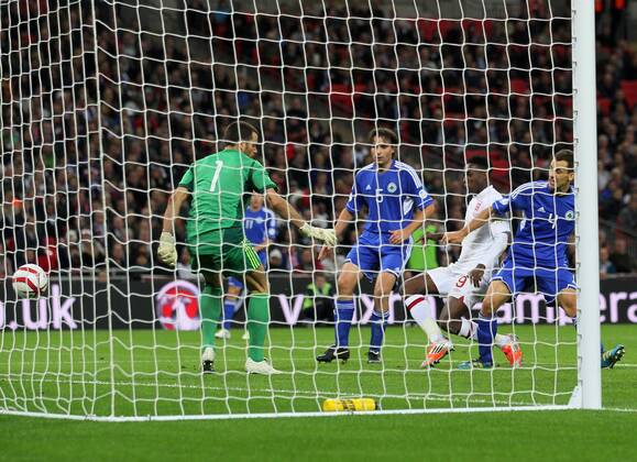 England s Danny Welbeck scoring his sides fourth goal..England v San Marino - FIFA World Cup Qualifier - Wembley Stadium- 12 10 12 - Picture David Klein Sportimage EDITORIAL USE ONLY. No use with unauthorised audio, video, data, fixture lists, club league logos or live services. Online in-match use limited to 120 images, no video emulation. No use in betting, games or single club league player publications.
