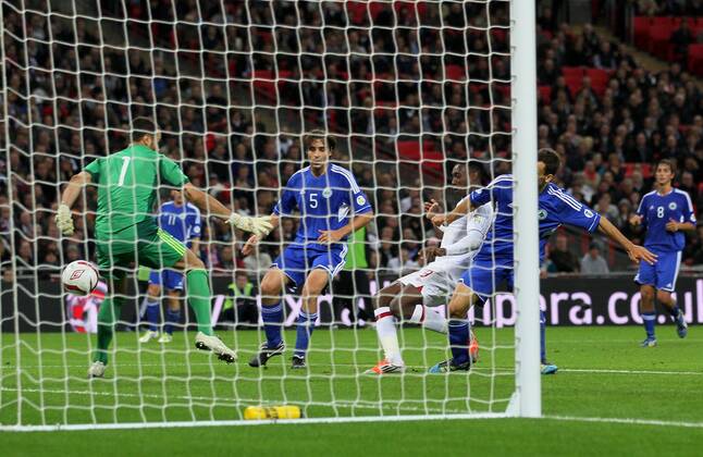 England s Danny Welbeck scoring his sides fourth goal..England v San Marino - FIFA World Cup Qualifier - Wembley Stadium- 12 10 12 - Picture David Klein Sportimage EDITORIAL USE ONLY. No use with unauthorised audio, video, data, fixture lists, club league logos or live services. Online in-match use limited to 120 images, no video emulation. No use in betting, games or single club league player publications.
