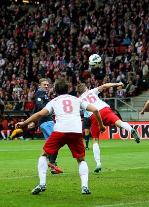 England s Wayne Rooney scoring his sides opening goal..Poland v England - FIFA World Cup Qualifier - National Stadium, Warsaw Stadium- 17 10 12 - Picture David Klein Sportimage EDITORIAL USE ONLY. No use with unauthorised audio, video, data, fixture lists, club league logos or live services. Online in-match use limited to 120 images, no video emulation. No use in betting, games or single club league player publications.