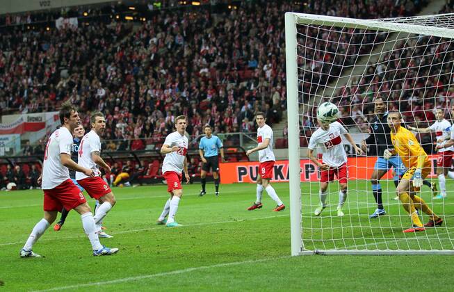 England s Wayne Rooney scoring his sides opening goal..Poland v England - FIFA World Cup Qualifier - National Stadium, Warsaw Stadium- 17 10 12 - Picture David Klein Sportimage EDITORIAL USE ONLY. No use with unauthorised audio, video, data, fixture lists, club league logos or live services. Online in-match use limited to 120 images, no video emulation. No use in betting, games or single club league player publications.
