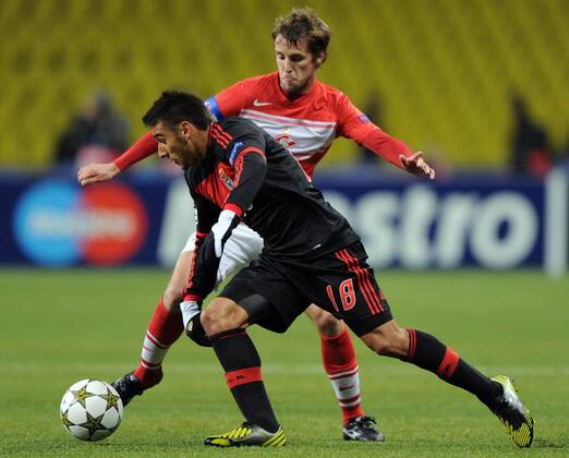 MOSCOW, RUSSIA. OCTOBER 23, 2012. Spartak s Dmitry Kombarov (red) and Eduardo Salvio of FC Benfica in action in their UEFA Champions League game in Moscow.  premiumd RE10B836