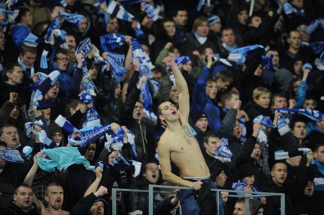 ST. PETERSBURG, RUSSIA. OCTOBER 24, 2012. FC Zenit s fans cheering for their team during a UEFA Champions League game vs. RSC Anderlecht in St Petersburg.  RE10BA69