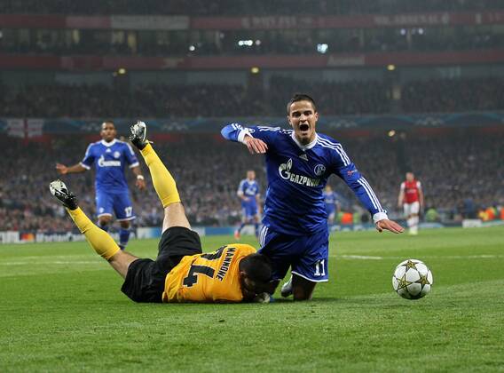 Schalke s Ibrahim Afellay gets booked for diving over Arsenal s Vito Mannone ..Arsenal London vs FC Schalke 04 - Champions League Group Match - The Emirates Stadium, London- 24 10 12 - EDITORIAL USE ONLY. No use with unauthorised audio, video, data, fixture lists, club league logos or live services. Online in-match use limited to 120 images, no video emulation. No use in betting, games or single club league player publications.