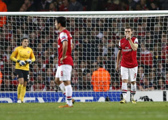 Arsenal s Thomas Vermaelen looks on dejected after going 1-0 down..Arsenal London vs FC Schalke 04 - Champions League Group Match - The Emirates Stadium, London- 24 10 12 - EDITORIAL USE ONLY. No use with unauthorised audio, video, data, fixture lists, club league logos or live services. Online in-match use limited to 120 images, no video emulation. No use in betting, games or single club league player publications.