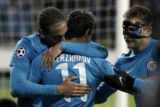 October 24, 2012. - Saint Petersburg. - Champions League 2012 13 - FC Zenit St Petersburg - RSC Anderlecht, 1:0. In picture: FC Zenit s players congratulate Aleksander Kerzhakov after his penalty goal. AndreyxPronin 