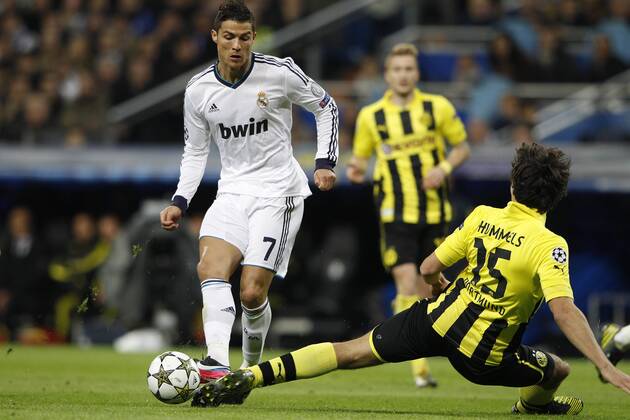 06.11.2012 Madrid, Spain. Champions League Real Madrid CF vs Borussia Dortmund (2-2) at Santiago Bernabeu stadium. The picture shows Cristiano Ronaldo (Real Madrid) and Mats Hummels (Borussia Dortmund) xEnriquexdexlaxFuentex  ActionPlus20147367