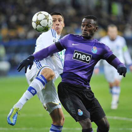 FC Dynamo Kyiv defender Yevhen Khacheridi (white kit) and FC Porto forward Jackson Martinez vie for the ball during the UEFA Champions League Group A match in . 
