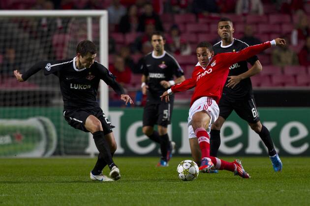 7 November 2012 - Lisbon, Portugal - Diniyar Bilyaletdinov FC Spartak Moskva midfielder (L) and Rodrigo SL Benfica forward (R) during the UEFA Champions League soccer match between SL Benfica from Portugal and FC Spartak Moskva from Russia, for group stage - group G, at SL Benfica, Luz Satadium in Lisbon. 