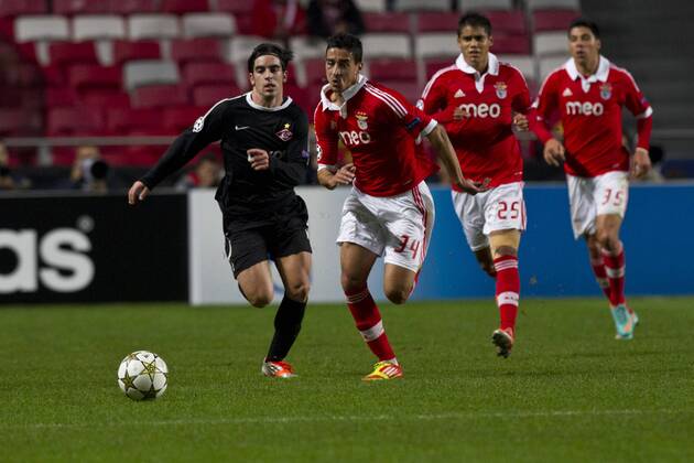 7 November 2012 - Lisbon, Portugal - Jose Manuel Jurado FC Spartak Moskva midfielder (L) and Andre Almeida SL Benfica defender (R) running for the ball during the UEFA Champions League soccer match between SL Benfica from Portugal and FC Spartak Moskva from Russia, for group stage - group G, at SL Benfica, Luz Satadium in Lisbon. 