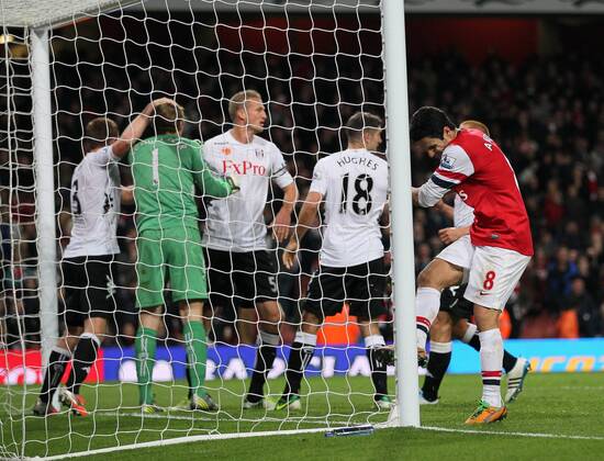 Arsenal s Mikel Arteta looks on dejected after missing a last minute penalty as Fulham s players celebrate.. - FC Arsenal vs FC Fulham - Premier League- Emirates Stadium, London- 10 11 12 - PicturexDavidxKlein xSportimage EDITORIAL USE ONLY. No use with unauthorised audio, video, data, fixture lists, club league logos or live services. Online in-match use limited to 120 images, no video emulation. No use in betting, games or single club league player publications.