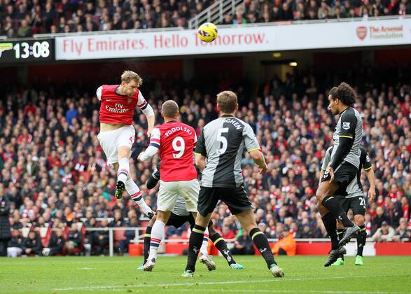 Arsenal s Per Mertesacker scoring his side opening goal..Arsenal v Tottenham - Premier League- Emirates Stdaium, London- 17 11 12 - Picture David Klein Sportimage EDITORIAL USE ONLY. No use with unauthorised audio, video, data, fixture lists, club league logos or live services. Online in-match use limited to 120 images, no video emulation. No use in betting, games or single club league player publications.
